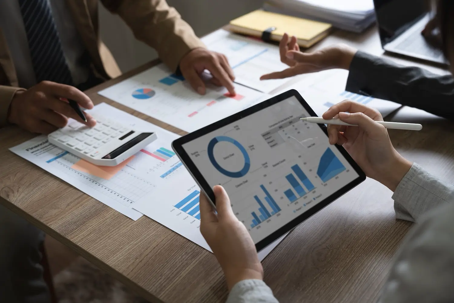 Small Business Cash Flow Management Tips in a Challenging Market 1 Team reviewing their cash flow forecast