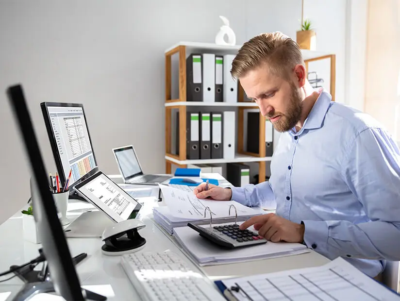 man with stack of invoices