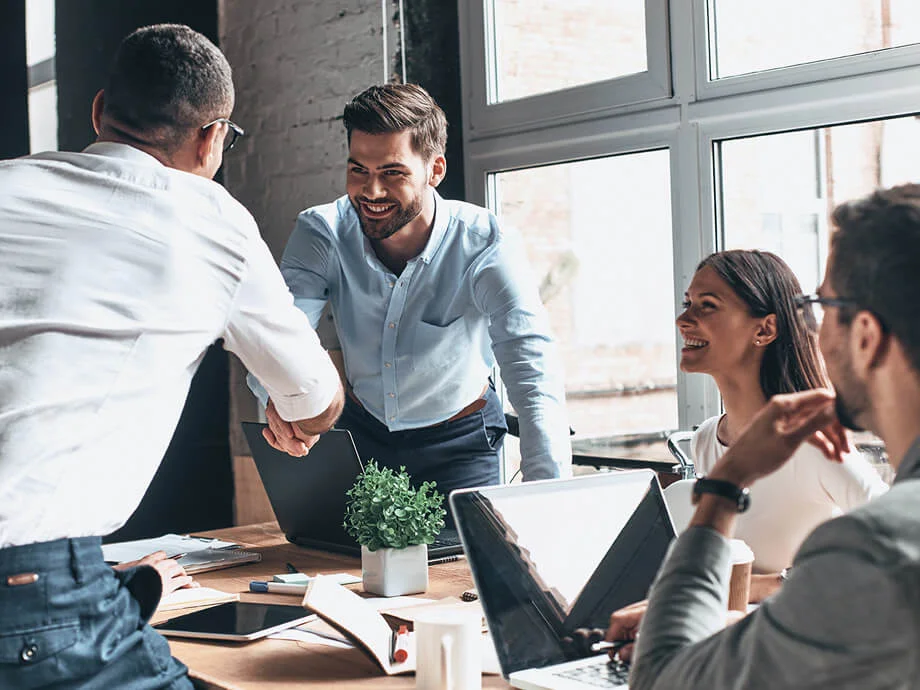 two-men-shake-hands-transaction-advisory-meeting