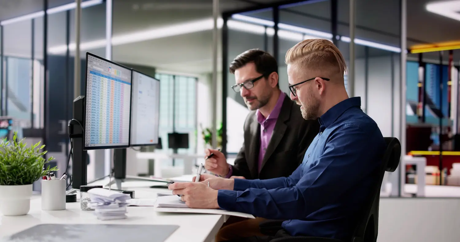 How to Plan and Make Decisions Like Recession-Proof Businesses 2 Two people working in office to recession-proof their business