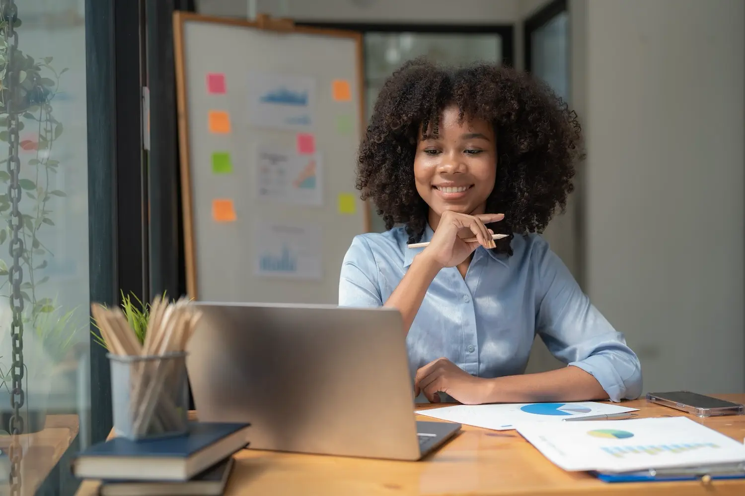 A business owner reviews her cash flow forecasts