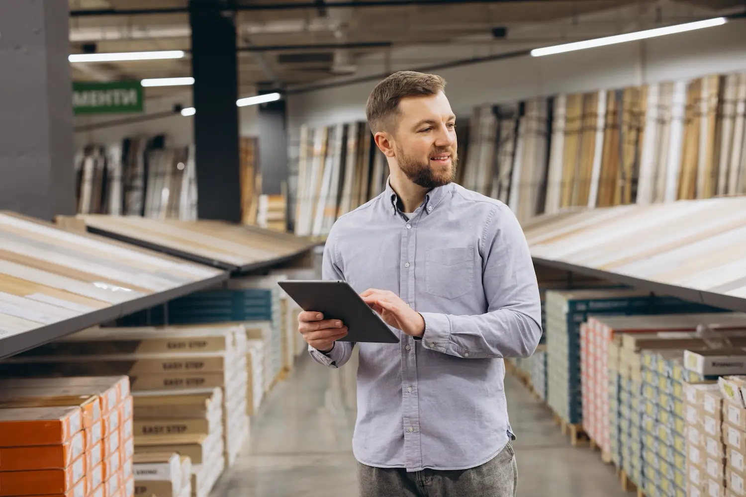 A finance manager reviews his company's inventory.